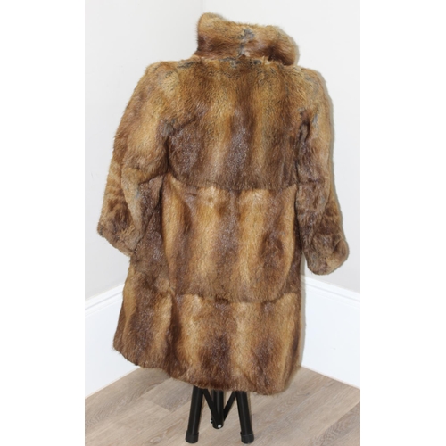 213 - A vintage Mary Quant waterproof poncho or cape, A vintage double-breasted sheepskin coat, label for ... 