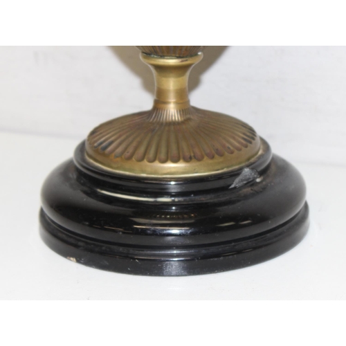 248 - An antique gilt metal oil lamp with black glazed pottery base, white glass shade and glass chimney, ... 