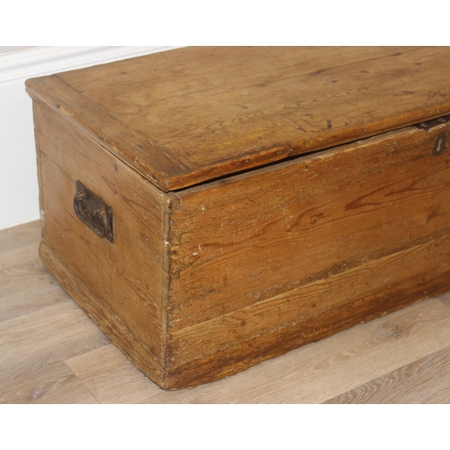 74 - A Victorian pine trunk with wrought iron handles, approx 105cm wide x 47cm deep x 37cm tall