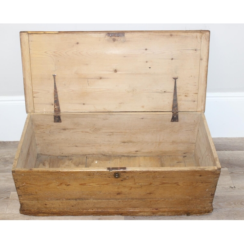 74 - A Victorian pine trunk with wrought iron handles, approx 105cm wide x 47cm deep x 37cm tall