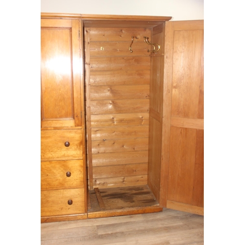 61 - A Victorian hall or housekeepers cupboard of large proportions, either satinwood or pine, a large co... 