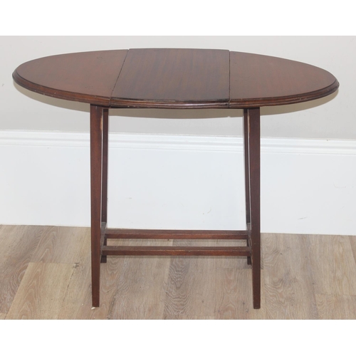 70 - A vintage mahogany nest of 3 tables and a mahogany drop leaf table, the largest of the nest of table... 