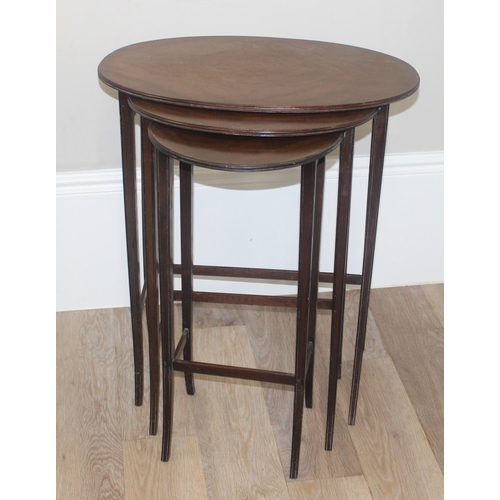 70 - A vintage mahogany nest of 3 tables and a mahogany drop leaf table, the largest of the nest of table... 