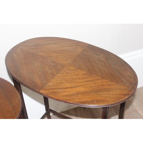 70 - A vintage mahogany nest of 3 tables and a mahogany drop leaf table, the largest of the nest of table... 