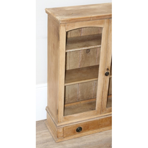 157 - An antique pine bookcase or glazed wall cabinet with single drawer to base, likely Victorian, approx... 