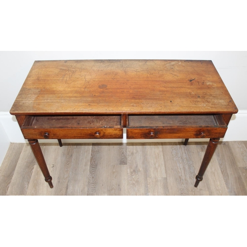 154 - A 19th century mahogany hall table or desk with 2 drawers, turned wooden handles and turned legs, ap... 