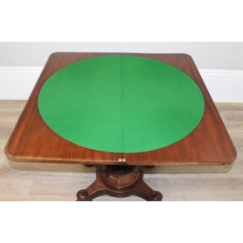 156 - A William IV period mahogany card table with carved details and a pillars support, green baize lined... 