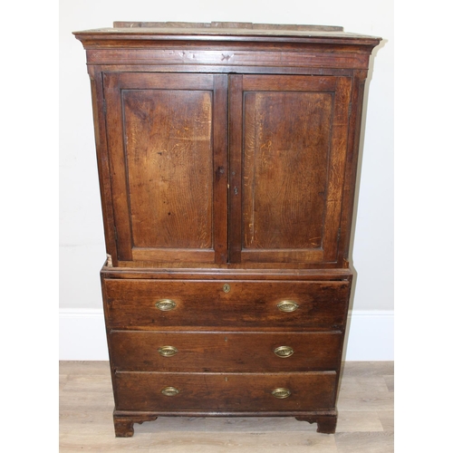 155 - A late 18th or early 19th century oak cabinet on stand, the top 2 door cabinet with 2 shelves, the 3... 