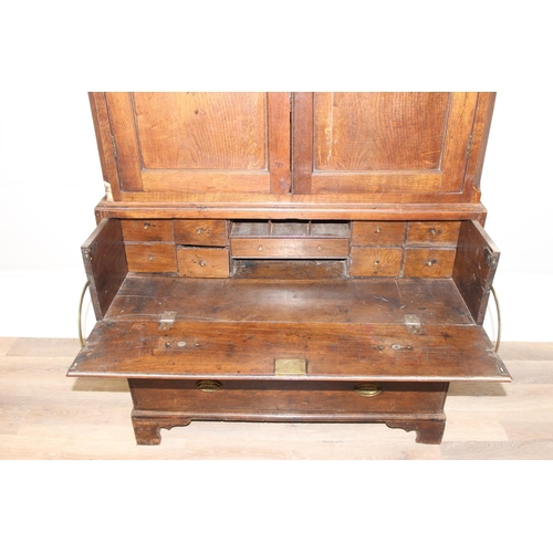 155 - A late 18th or early 19th century oak cabinet on stand, the top 2 door cabinet with 2 shelves, the 3... 