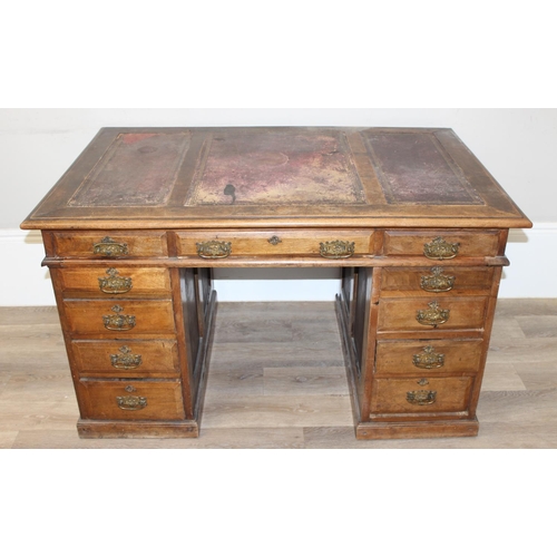 173 - Early 20th century leather-topped 3-part desk with 3 drawers over 8 and brass handles, approx 127cm ... 