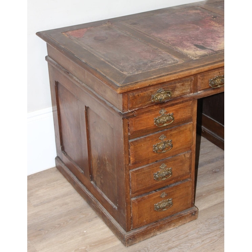 173 - Early 20th century leather-topped 3-part desk with 3 drawers over 8 and brass handles, approx 127cm ... 