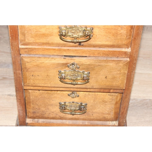 173 - Early 20th century leather-topped 3-part desk with 3 drawers over 8 and brass handles, approx 127cm ... 