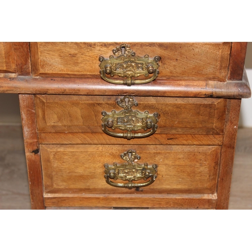 173 - Early 20th century leather-topped 3-part desk with 3 drawers over 8 and brass handles, approx 127cm ... 