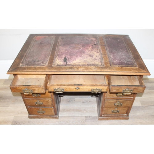 173 - Early 20th century leather-topped 3-part desk with 3 drawers over 8 and brass handles, approx 127cm ... 