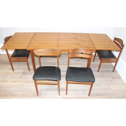 151 - A retro extending dining table and a set of 4 harlequin matched retro dining chairs, all pieces seem... 