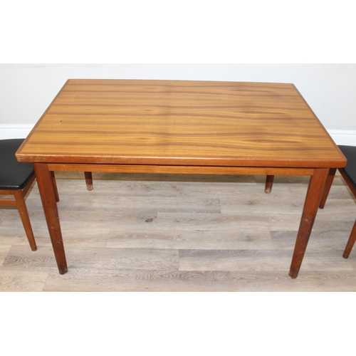 151 - A retro extending dining table and a set of 4 harlequin matched retro dining chairs, all pieces seem... 