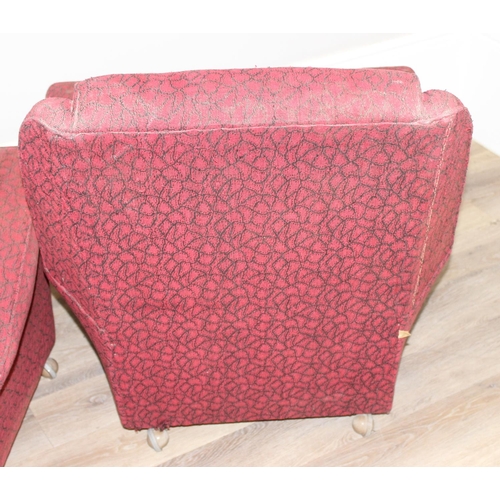 65 - A pair of retro red and black patterned armchairs, seemingly unmarked, approx 83cm tall