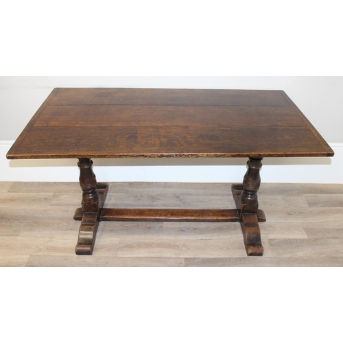 141 - An antique style oak refectory table on turned legs, approx 150cm x 83cm x 75cm