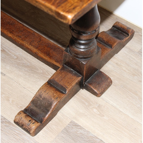 141 - An antique style oak refectory table on turned legs, approx 150cm x 83cm x 75cm