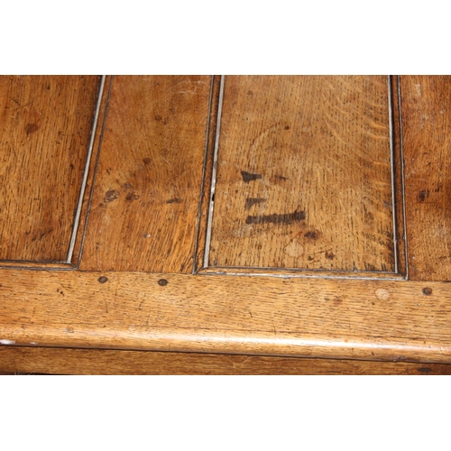 140 - An antique oak monk's bench or settle on castors, pegged joints with lift up seat, approx 115cm x 59... 