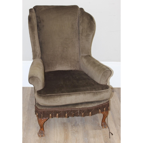 138 - Vintage wing-back arm chair with green-brown upholstery and carved claw feet