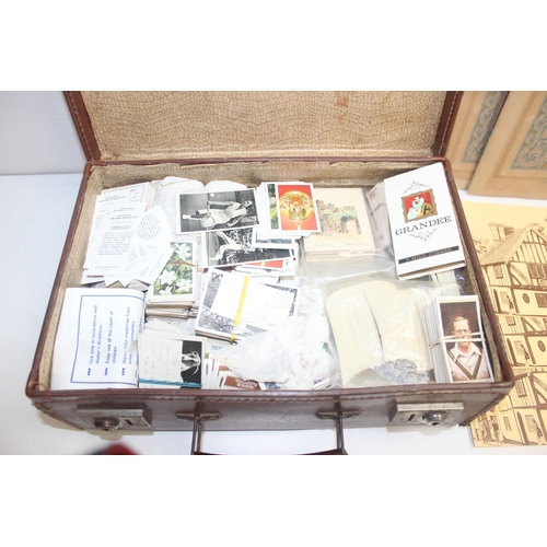 574 - A vintage suitcase full of assorted ephemera, mainly cigarette and tea cards etc