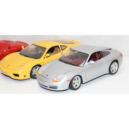 692 - Qty of assorted Burago model cars to inc Ferrari, Porsche etc, mainly 1/18th and 1/24th scale (13)