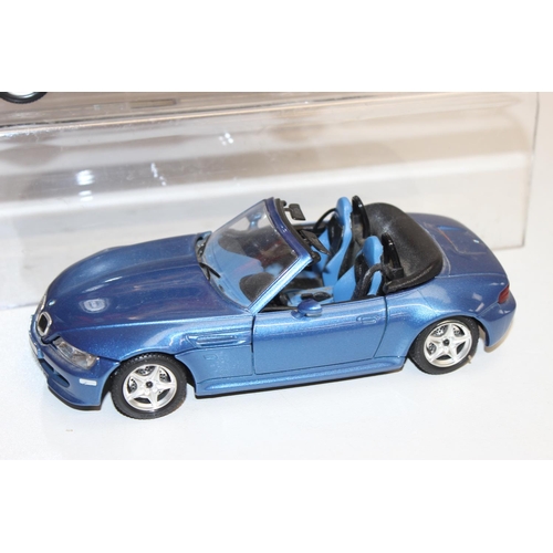 693 - Qty of assorted model toy cars to inc a boxed Majorette 1/18 Ferrari F355, Corgi MGB & MGF, and othe... 