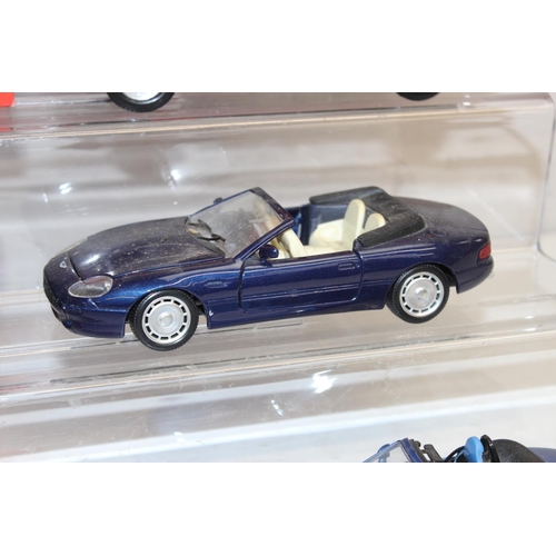 693 - Qty of assorted model toy cars to inc a boxed Majorette 1/18 Ferrari F355, Corgi MGB & MGF, and othe... 