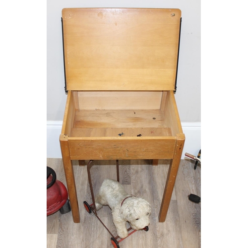 695 - Vintage pine children's school desk, with a push-along dog stuffed dog, tin-plate tricycle and ride ... 