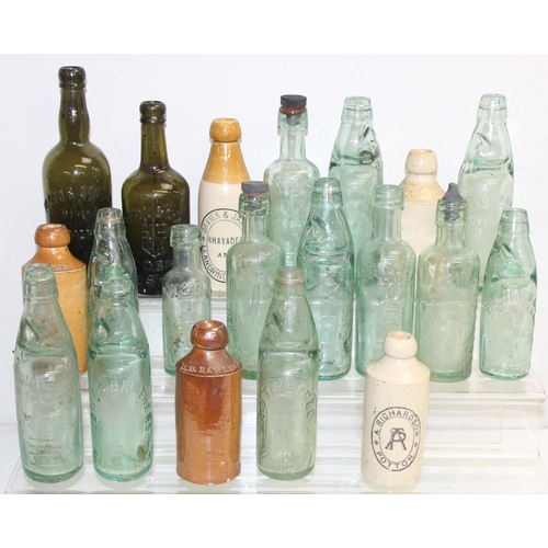 1657 - Qty of assorted antique and later glass and pottery bottles, many advertising, and some with local i... 