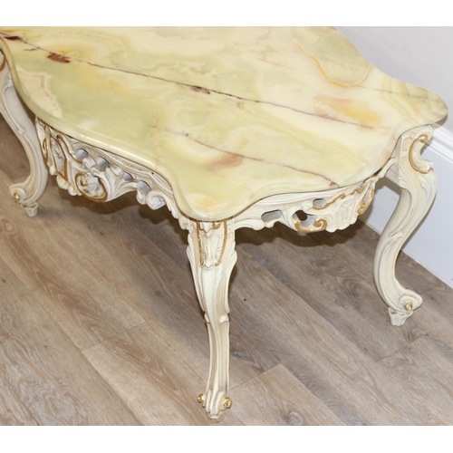 124 - A Baroque style onyx topped low table with painted and gilt wooden base and green onyx shaped top, a... 