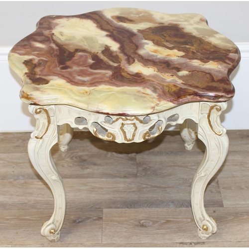 126 - A Baroque style onyx topped low table with painted and gilt wooden base and a highly figured green o... 