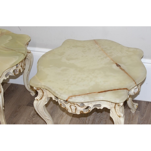 125 - A pair of Baroque style onyx topped low tables with painted and gilt wooden bases and green onyx sha... 