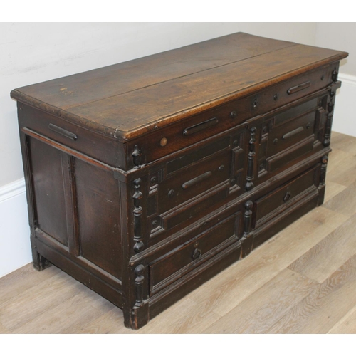 91 - A 17th or early 18th century oak mule chest with 2 drawers to base, lift up top and later lined wood... 