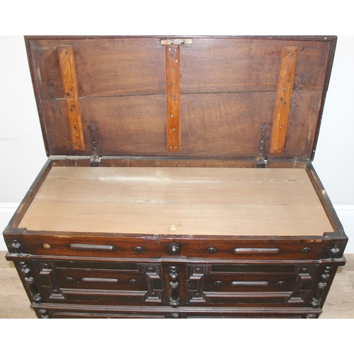 91 - A 17th or early 18th century oak mule chest with 2 drawers to base, lift up top and later lined wood... 