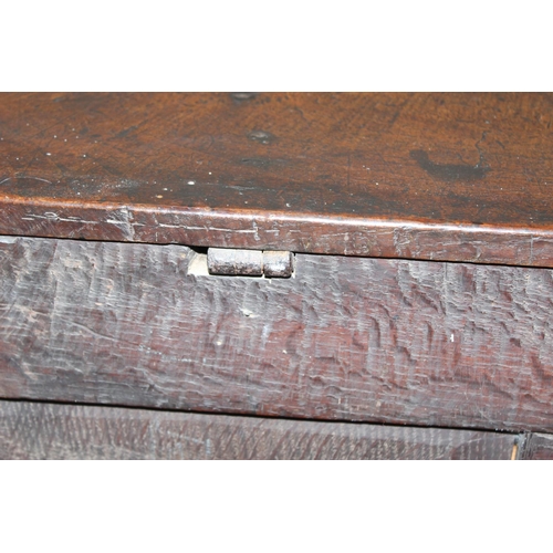 91 - A 17th or early 18th century oak mule chest with 2 drawers to base, lift up top and later lined wood... 