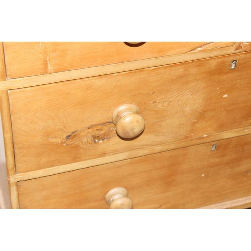 112 - A Victorian pine 2 over 2 chest of drawers with turned wooden feet and bun handles, approx 90cm wide... 