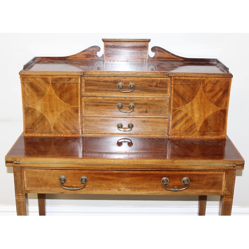 80 - An Edwardian ladies writing desk with various small cupboards and drawers over a green baize lined f... 