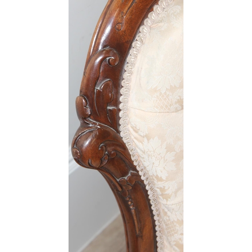 87 - A 19th century button back nursing chair with carved mahogany frame, approx 90cm tall