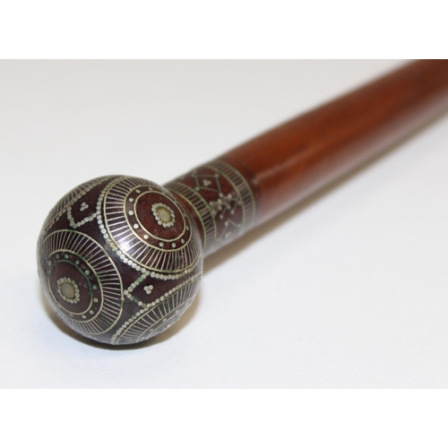 1054A - An unusual antique walking cane with silver pique work inlaid decoration, possibly Russian in origin... 