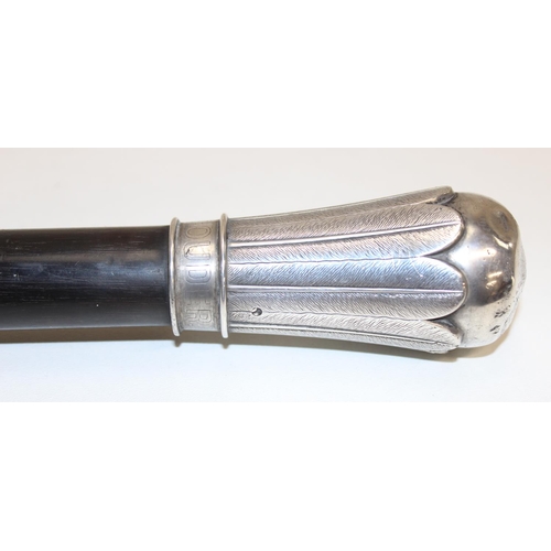 1054B - An unusual antique silver topped walking cane with ebony shaft, the top seemingly unmarked but XRF c... 