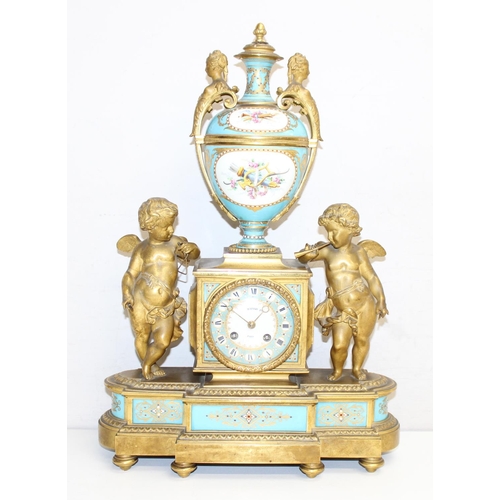 1324 - A 19th century French Ormolu and Porcelain Mounted Striking Mantel Clock garniture, signed Raingo Fr... 