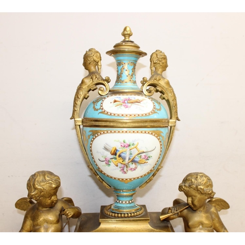 1324 - A 19th century French Ormolu and Porcelain Mounted Striking Mantel Clock garniture, signed Raingo Fr... 