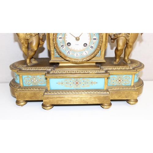 1324 - A 19th century French Ormolu and Porcelain Mounted Striking Mantel Clock garniture, signed Raingo Fr... 