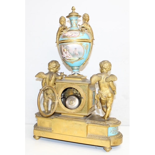 1324 - A 19th century French Ormolu and Porcelain Mounted Striking Mantel Clock garniture, signed Raingo Fr... 