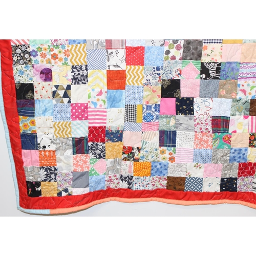 216 - A modern and highly colourful patchwork quilt with fleece backing, approx 144cm x 103cm