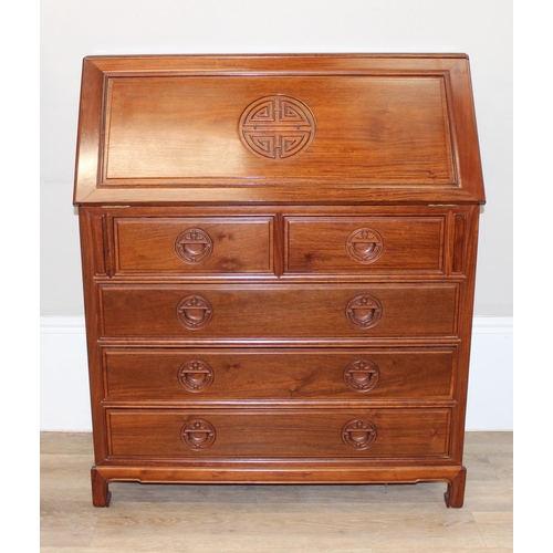 64 - A 20th century Chinese hardwood bureau with drop down front and 2 over 3 drawers to base, carved Chi... 