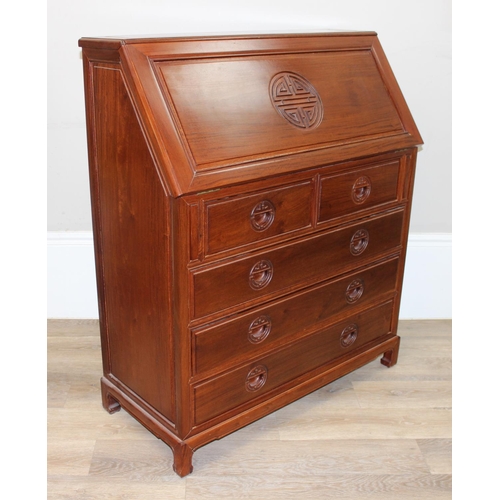 64 - A 20th century Chinese hardwood bureau with drop down front and 2 over 3 drawers to base, carved Chi... 