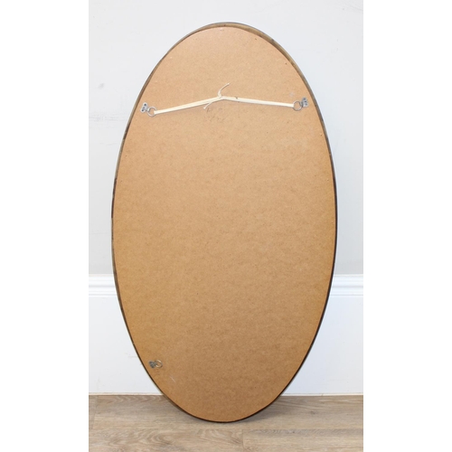 459A - An antique style distressed gilt framed oval shaped wall mirror, approx 98cm x 52cm